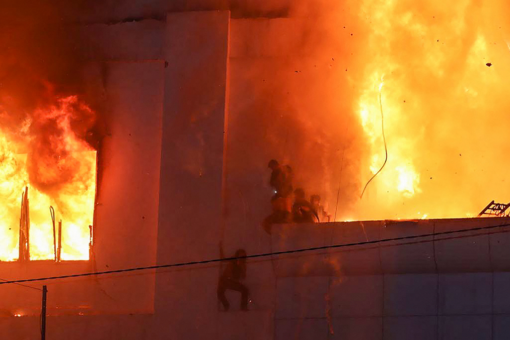 Dramatic images show people trying to flee massive fire at Cambodia hotel casino that left at least 16 dead