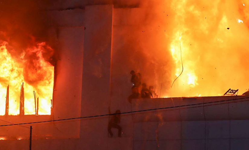 Dramatic images show people trying to flee massive fire at Cambodia hotel casino that left at least 16 dead