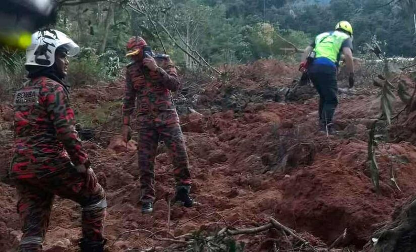 Malaysian landslide kills 18 at campground, rescuers search for 15 others