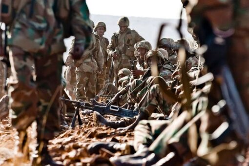 Video shows southern African soldiers throwing bodies on pile of burning rubble in Mozambique